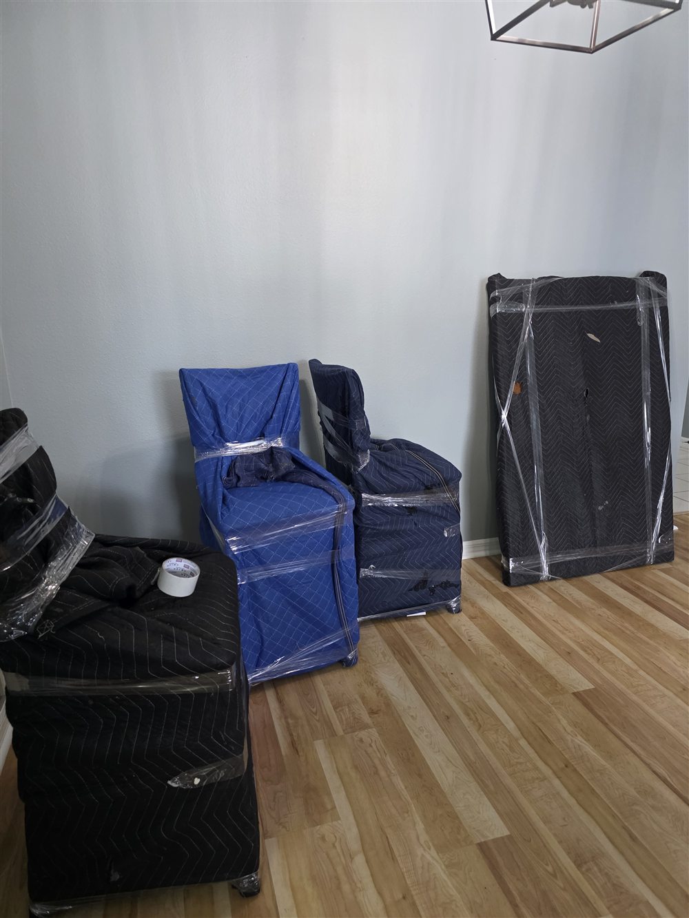 Furniture carefully wrapped and padded by the Apache Moving crew before transport
