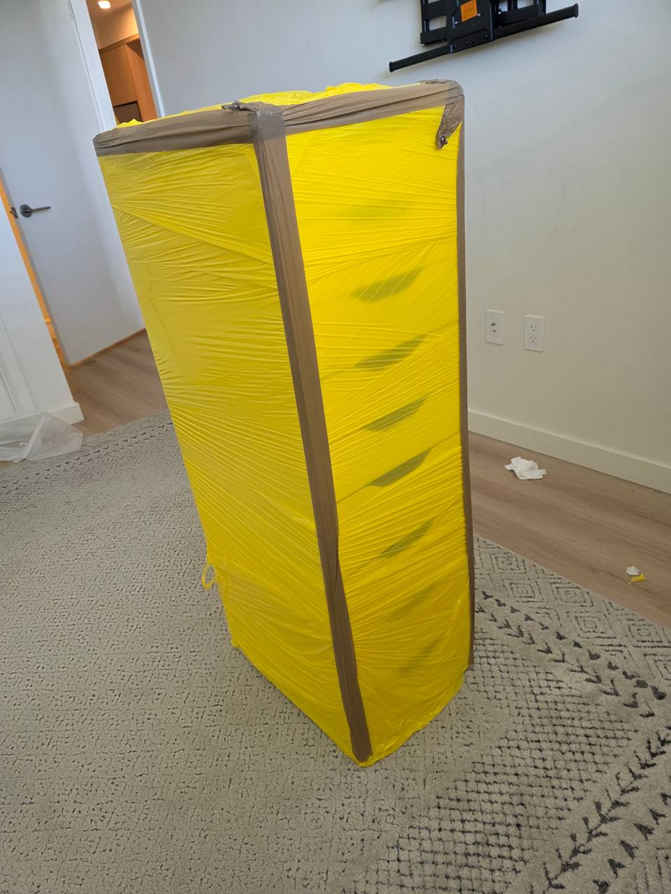 Shrink-wrapped wardrobe protected before a local move